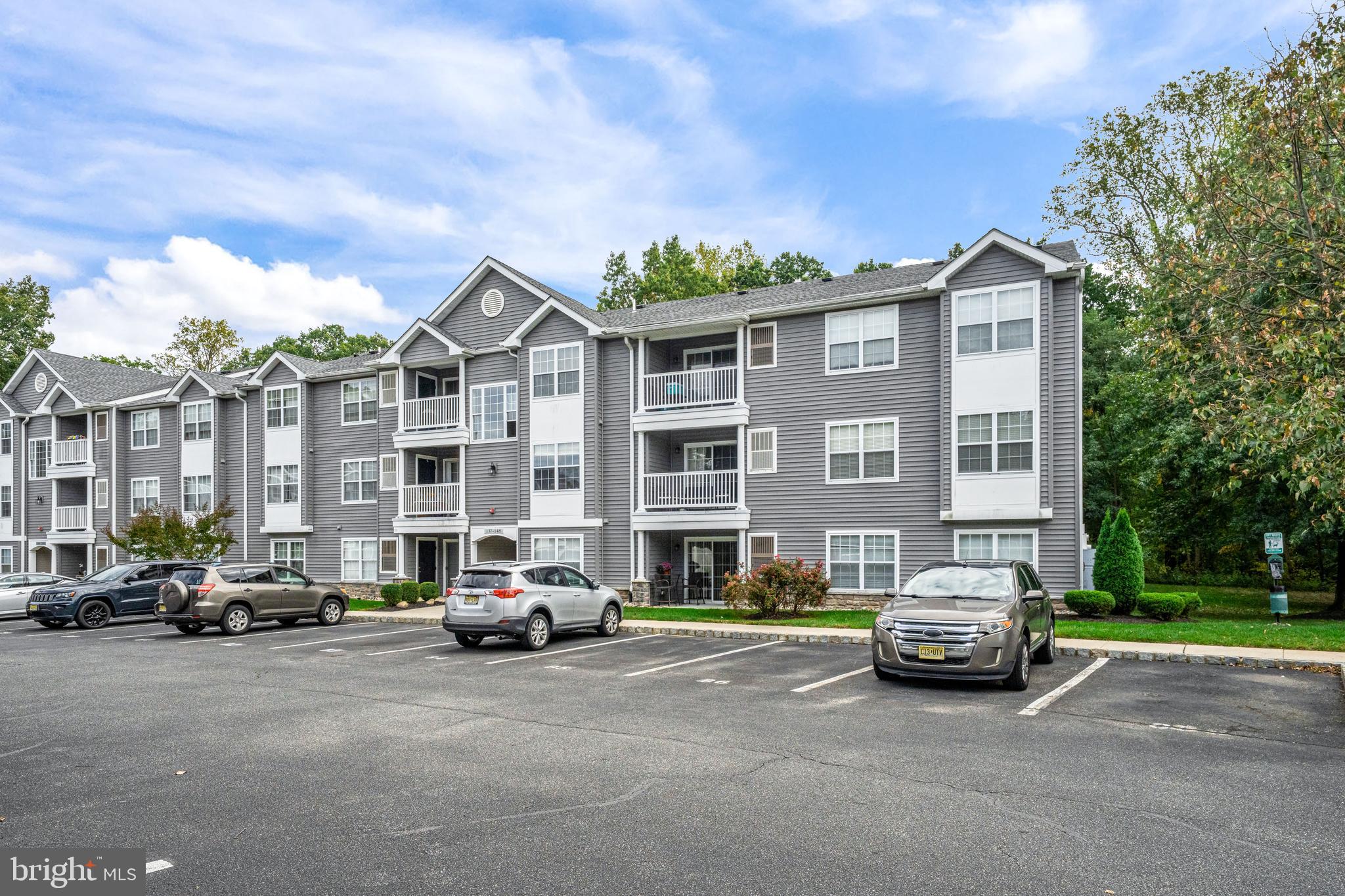 144 Natalie Road Delran, NJ 08075 - Photo 35 of 43 a city street lined with parked cars and buildings