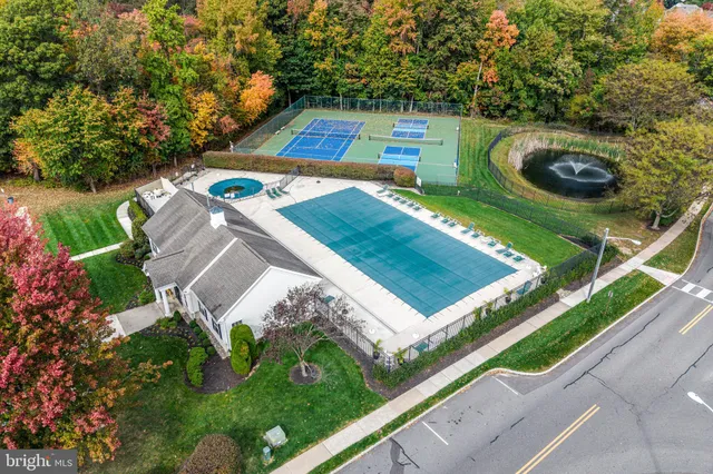 an aerial view of a house with yard