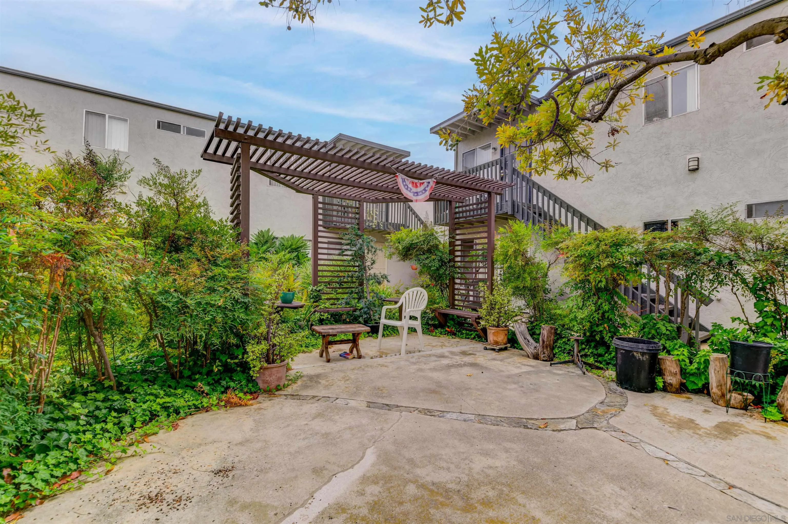 9550 Campo Road Spring Valley, CA 91977 - Photo 5 of 16 a view of a patio with table and chairs and potted plants