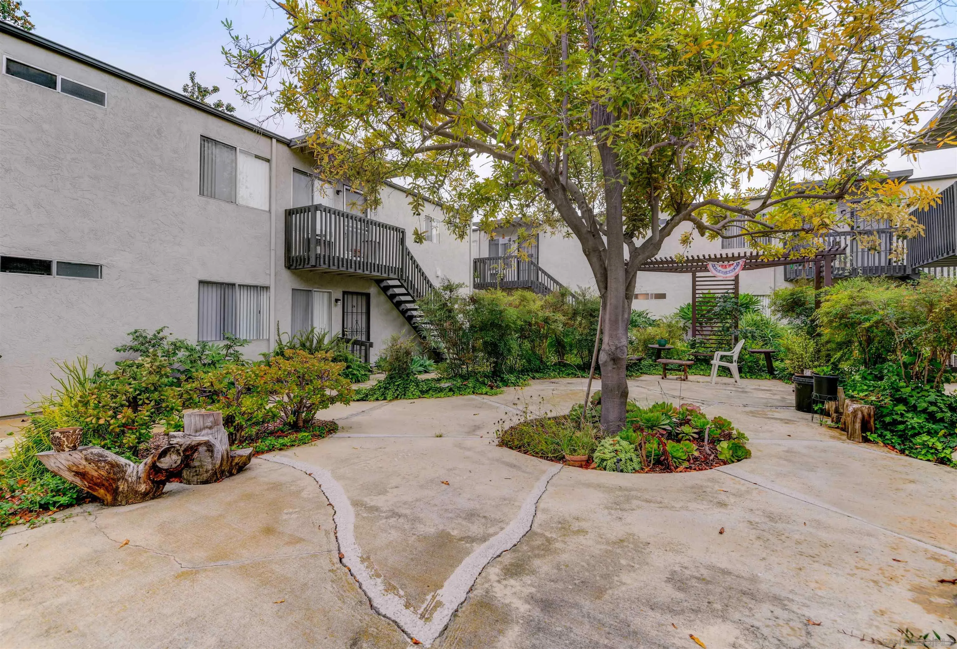 9550 Campo Road Spring Valley, CA 91977 - Photo 10 of 16 a front view of a house with a yard and fountain