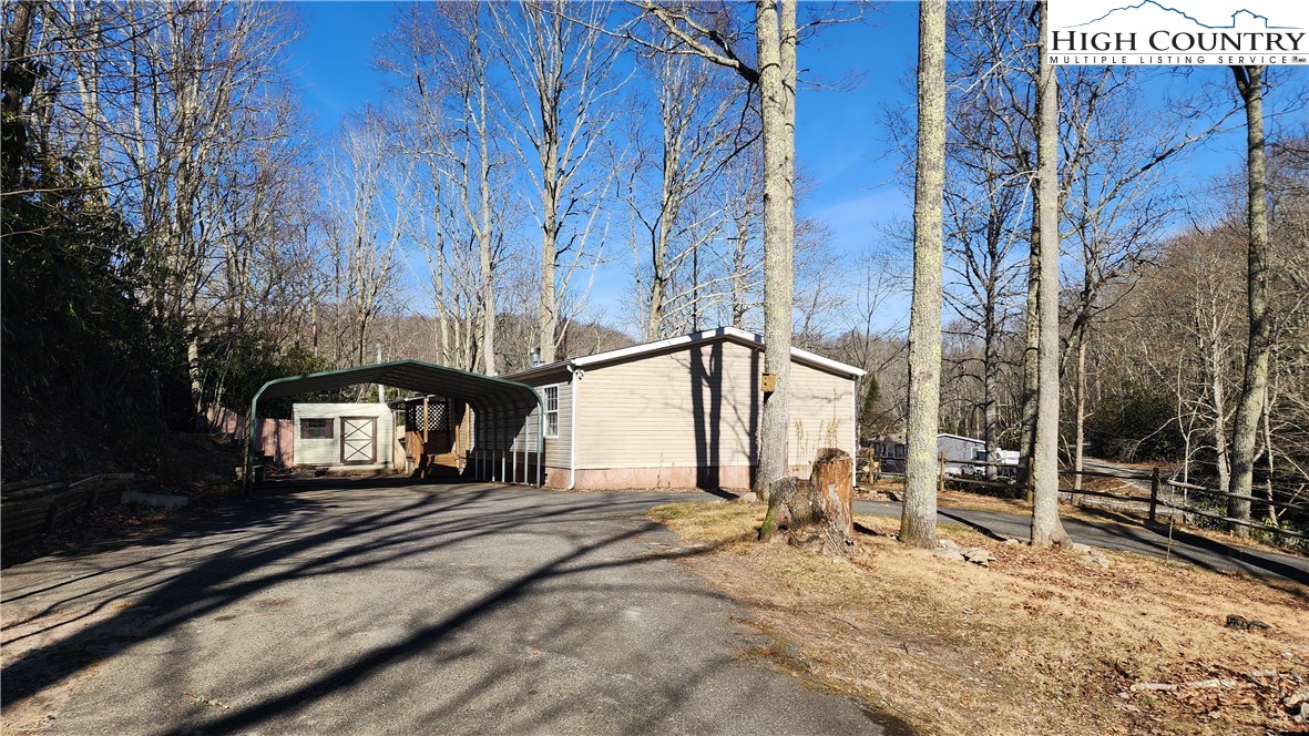 68 Rhoneys View Road Newland, NC 28657 - Photo 36 of 37 a front view of a house with a yard