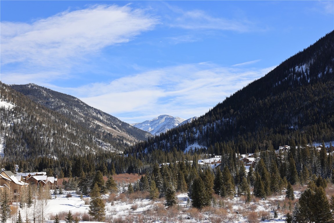 75 Hunki Dori Court, Unit W312 Keystone, CO 80435 - Photo 2 of 35 a view of a town with mountains in the background