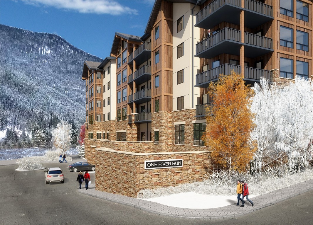 75 Hunki Dori Court, Unit W312 Keystone, CO 80435 - Photo 22 of 35 a tall building sitting on the side of a street