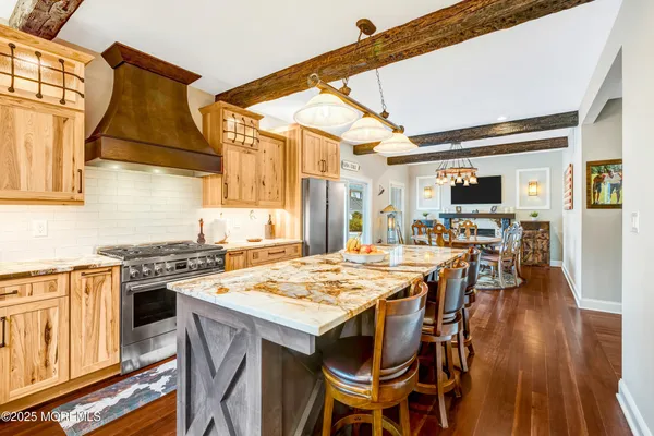 a kitchen with a stove a sink and a cabinets