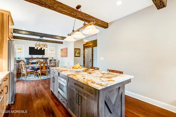 a living room with fireplace furniture and a flat screen tv