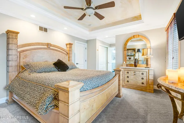 a bathroom with a sink a mirror and a shower