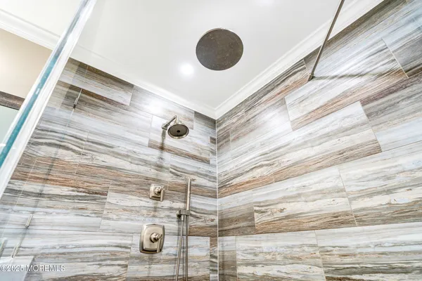 a bathroom with a sink a toilet and shower curtain