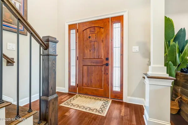 a view of an entryway with wooden floor