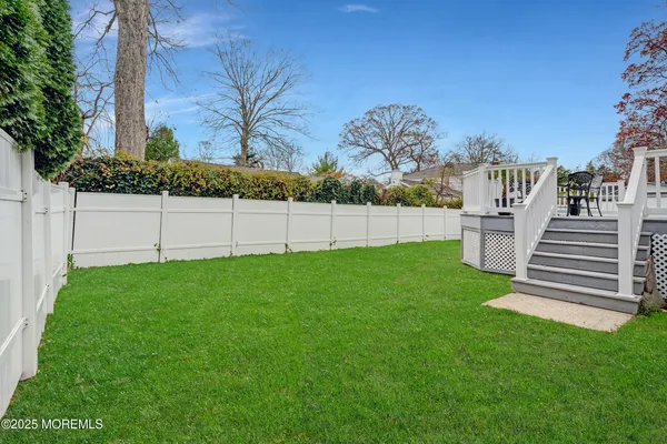 an aerial view of multiple houses with yard
