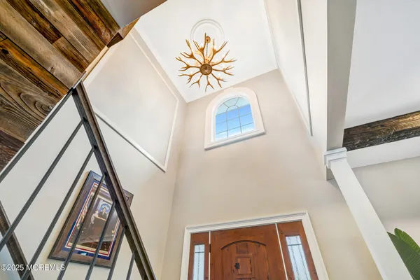 a view of staircase with wooden floor and a rug