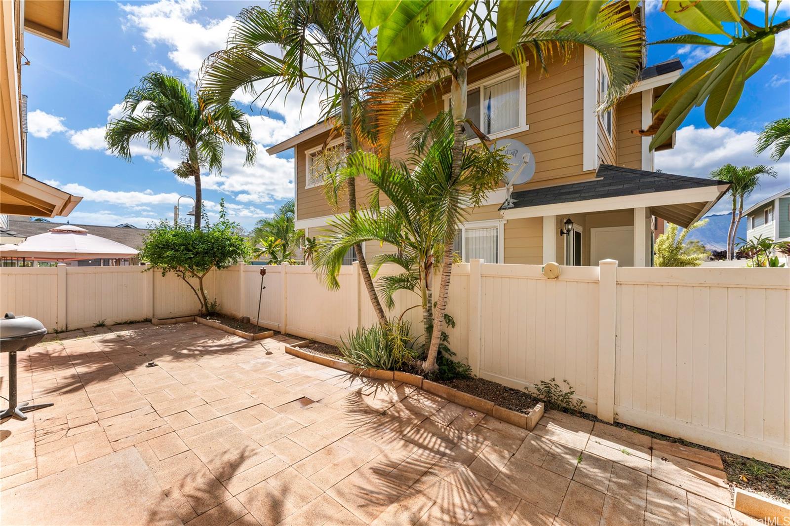 87-1962 Pakeke Street, Unit A Waianae, HI 96792 - Photo 19 of 25 a view of a house with a yard and potted plants