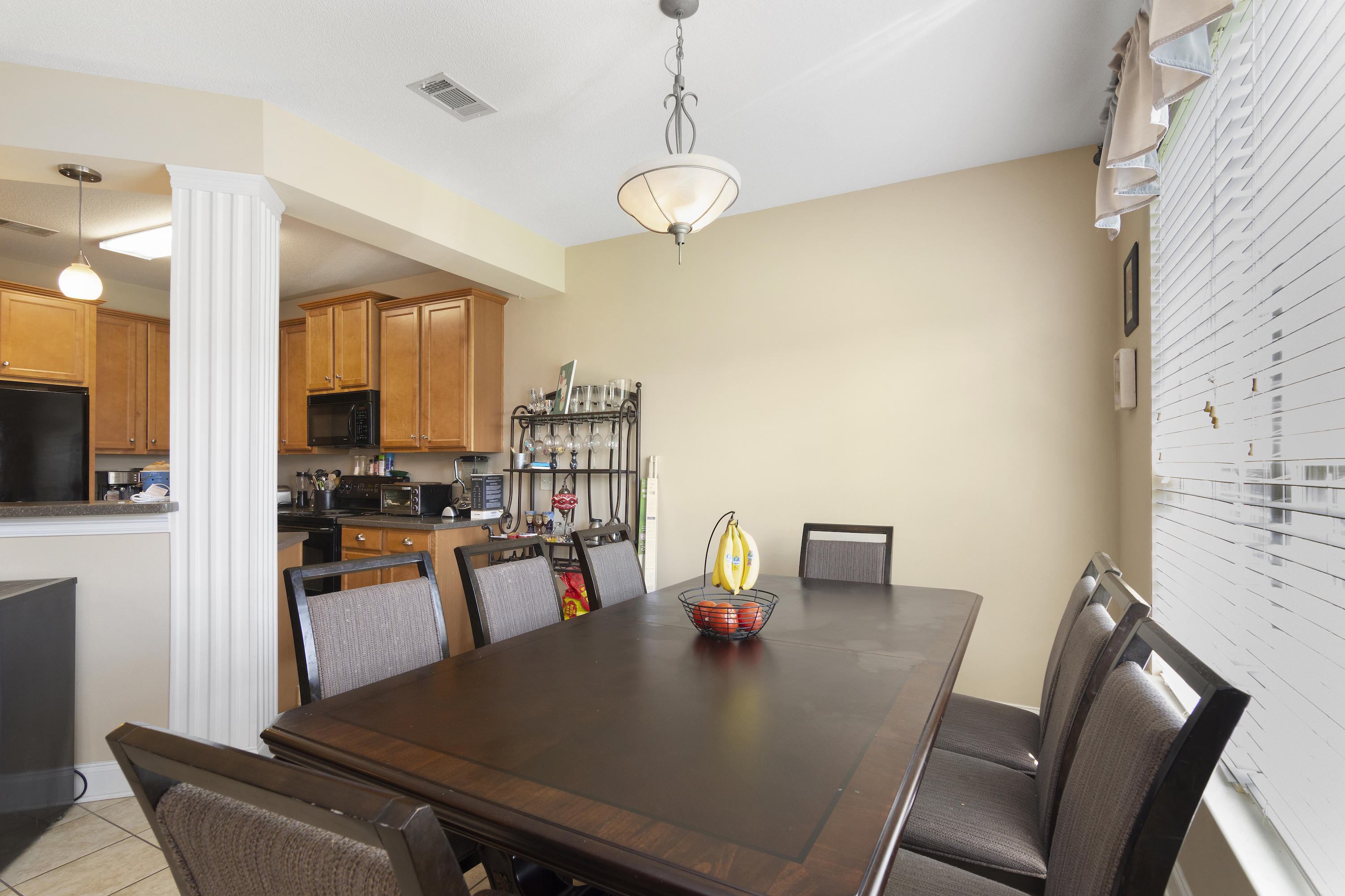 145 Alicia Drive Crestview, FL 32536 - Photo 15 of 32 a view of a dining room with furniture window and wooden floor