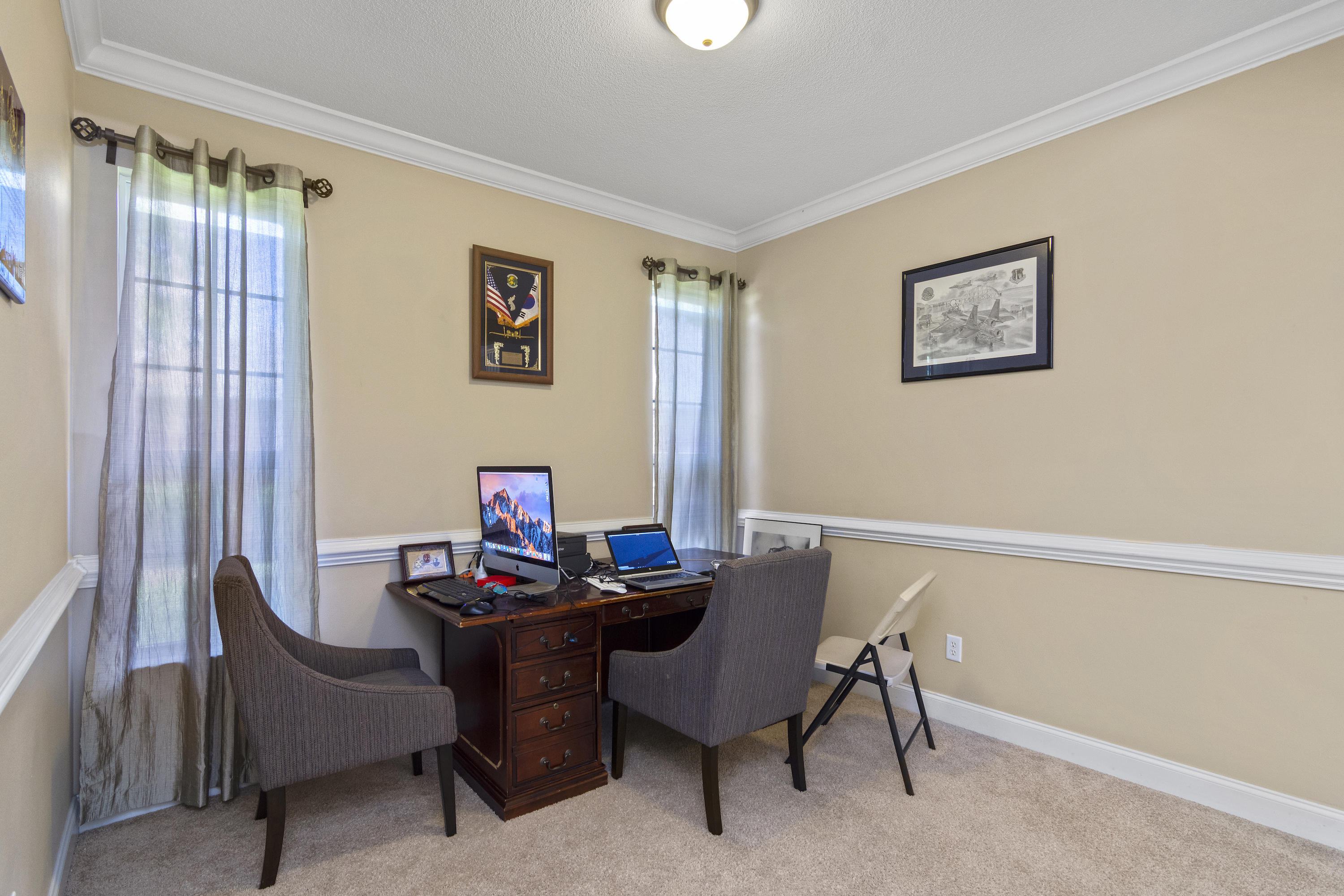 145 Alicia Drive Crestview, FL 32536 - Photo 16 of 32 a view of a workspace with furniture and a window