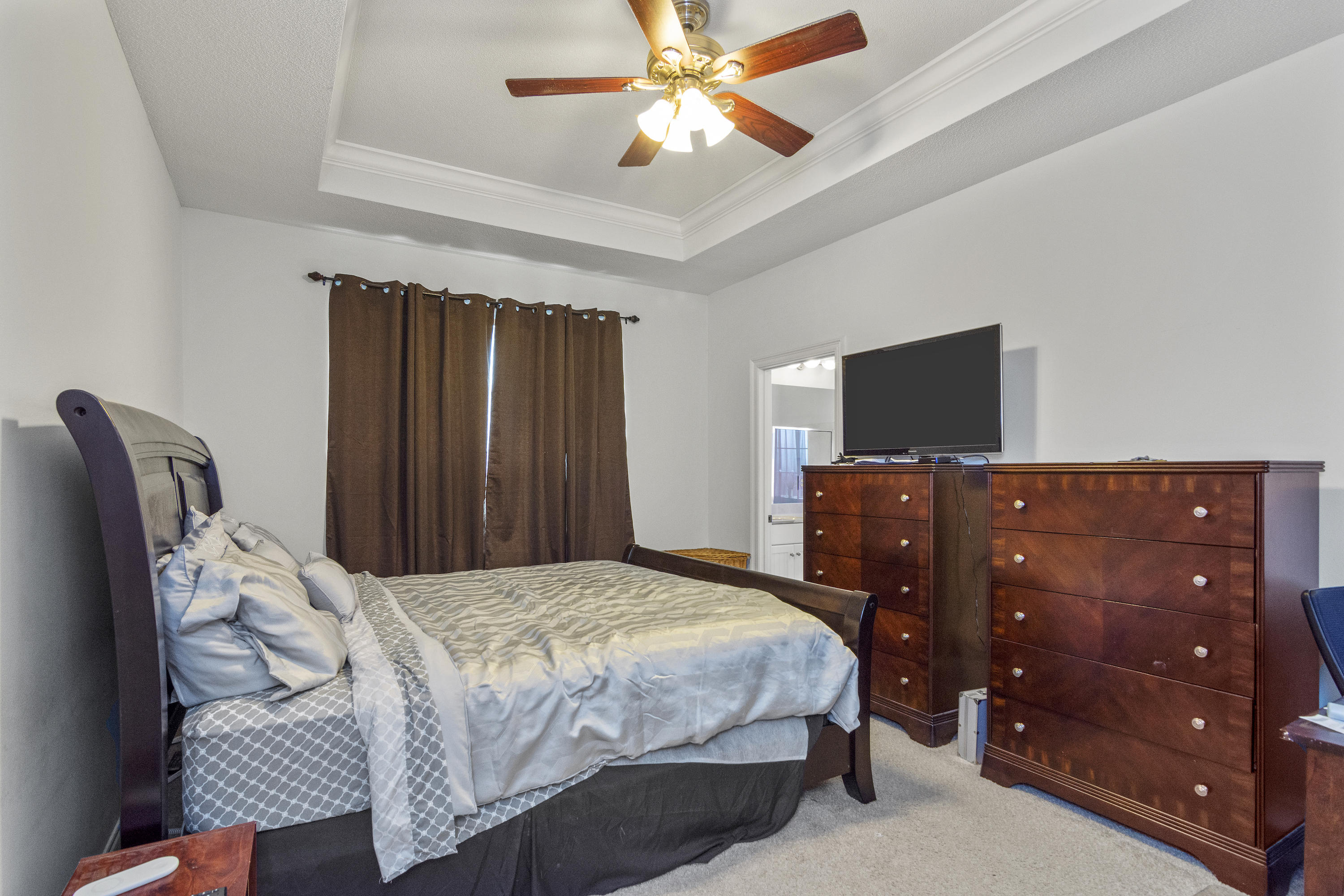 145 Alicia Drive Crestview, FL 32536 - Photo 17 of 32 a bedroom with a bed and a television