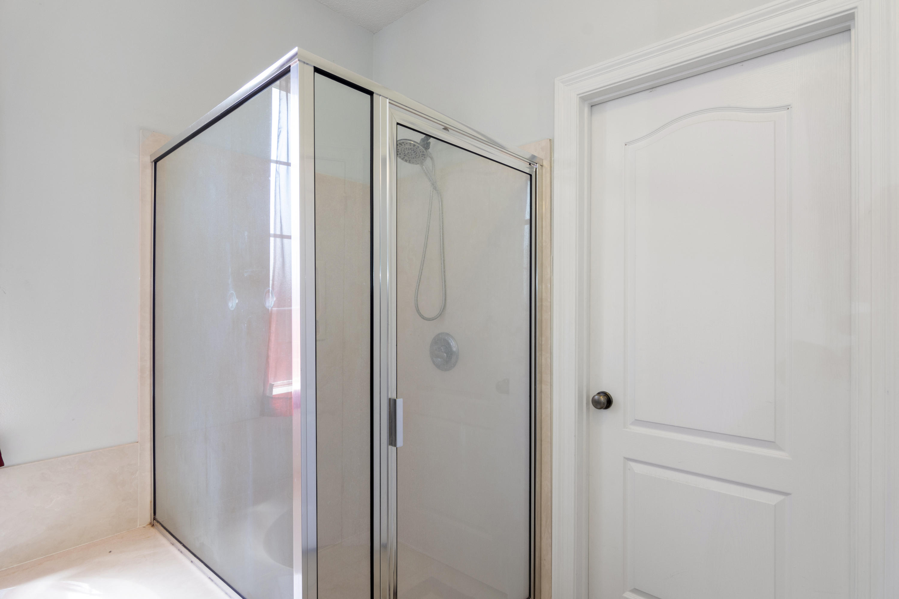 145 Alicia Drive Crestview, FL 32536 - Photo 20 of 32 a bathroom with a shower and a glass door