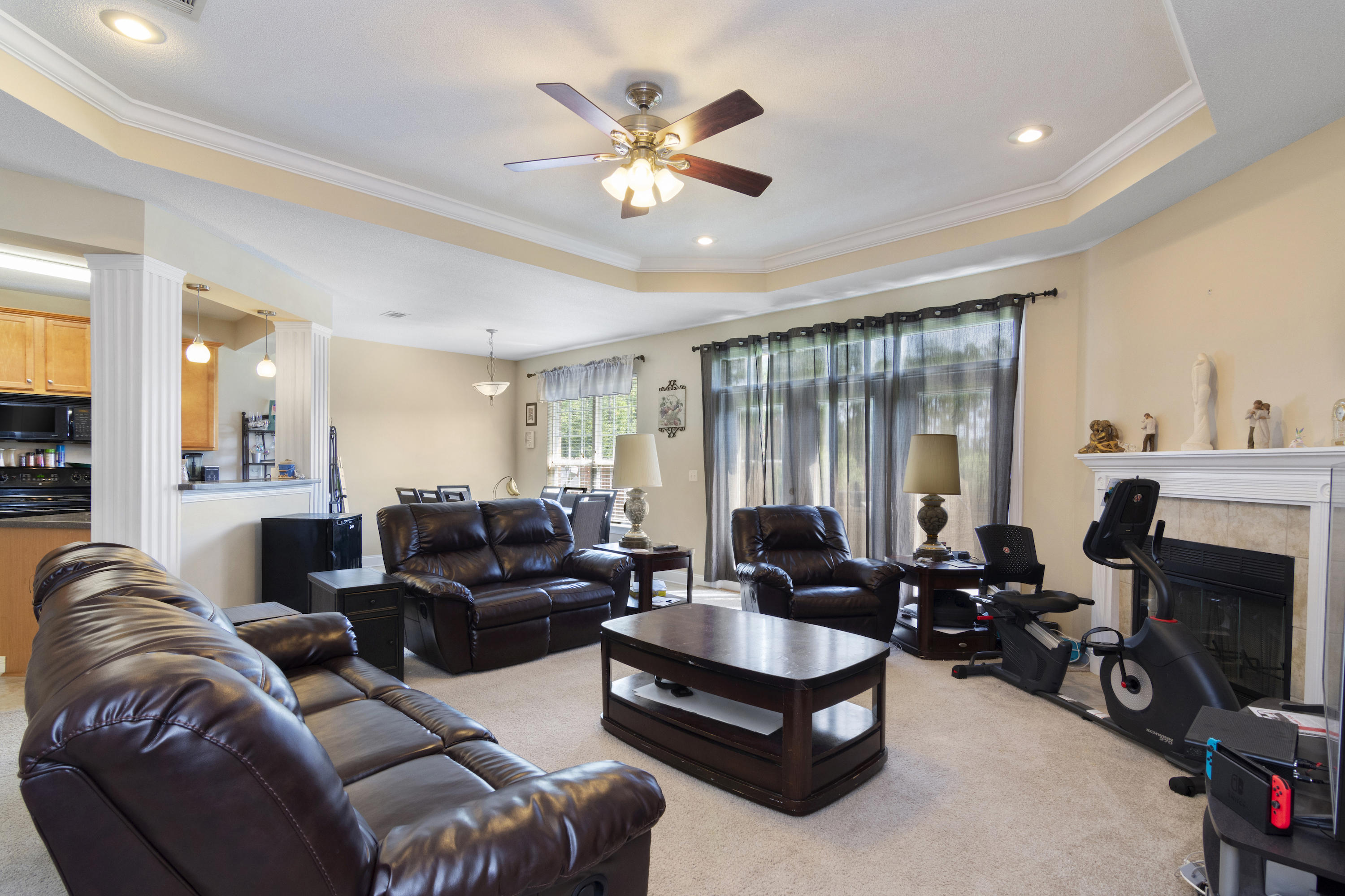 145 Alicia Drive Crestview, FL 32536 - Photo 7 of 32 a living room with furniture ceiling fan and a large window
