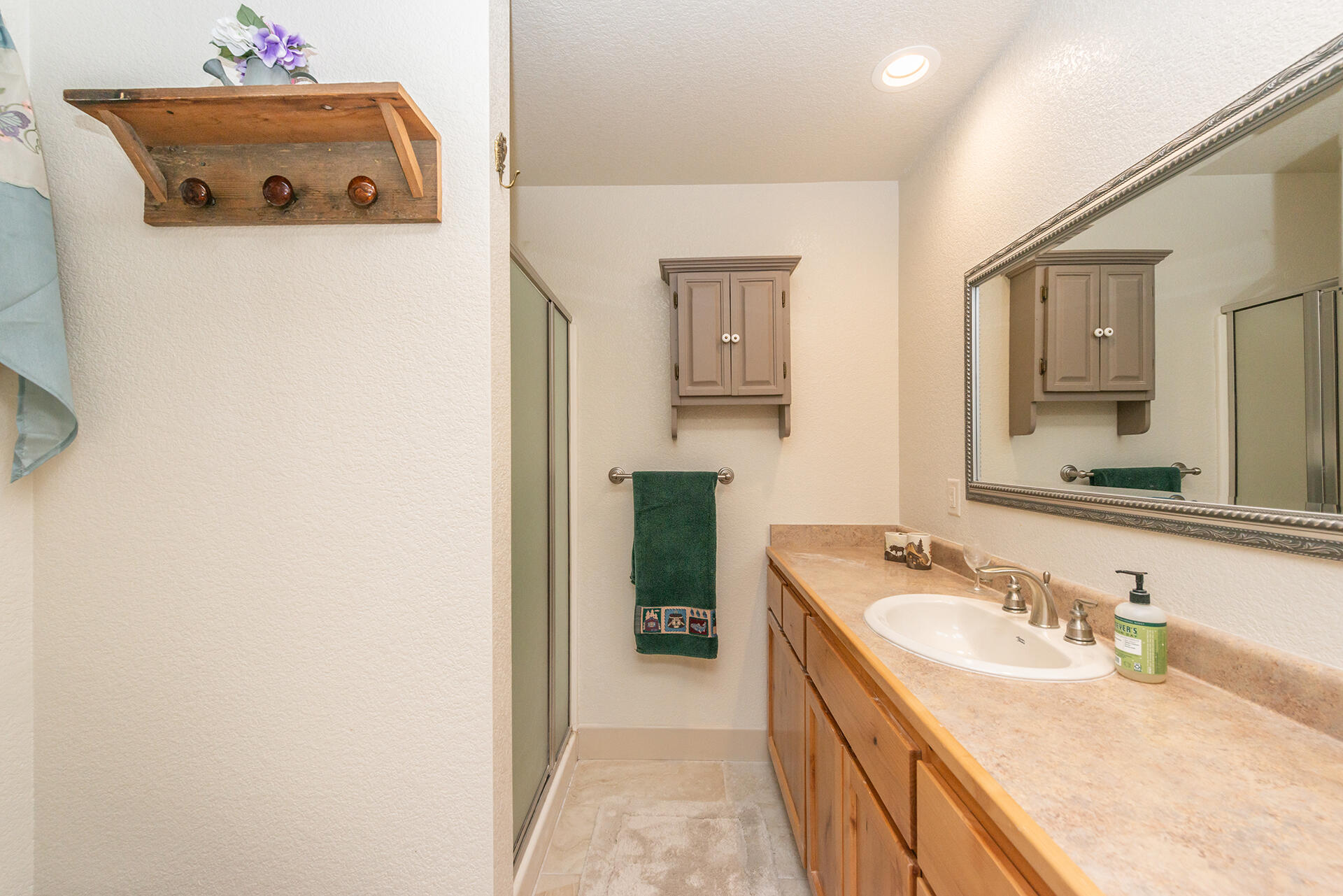 851 Mountain Aire Road Trinity Center, CA 96091 - Photo 19 of 54 a bathroom with a sink vanity and mirror