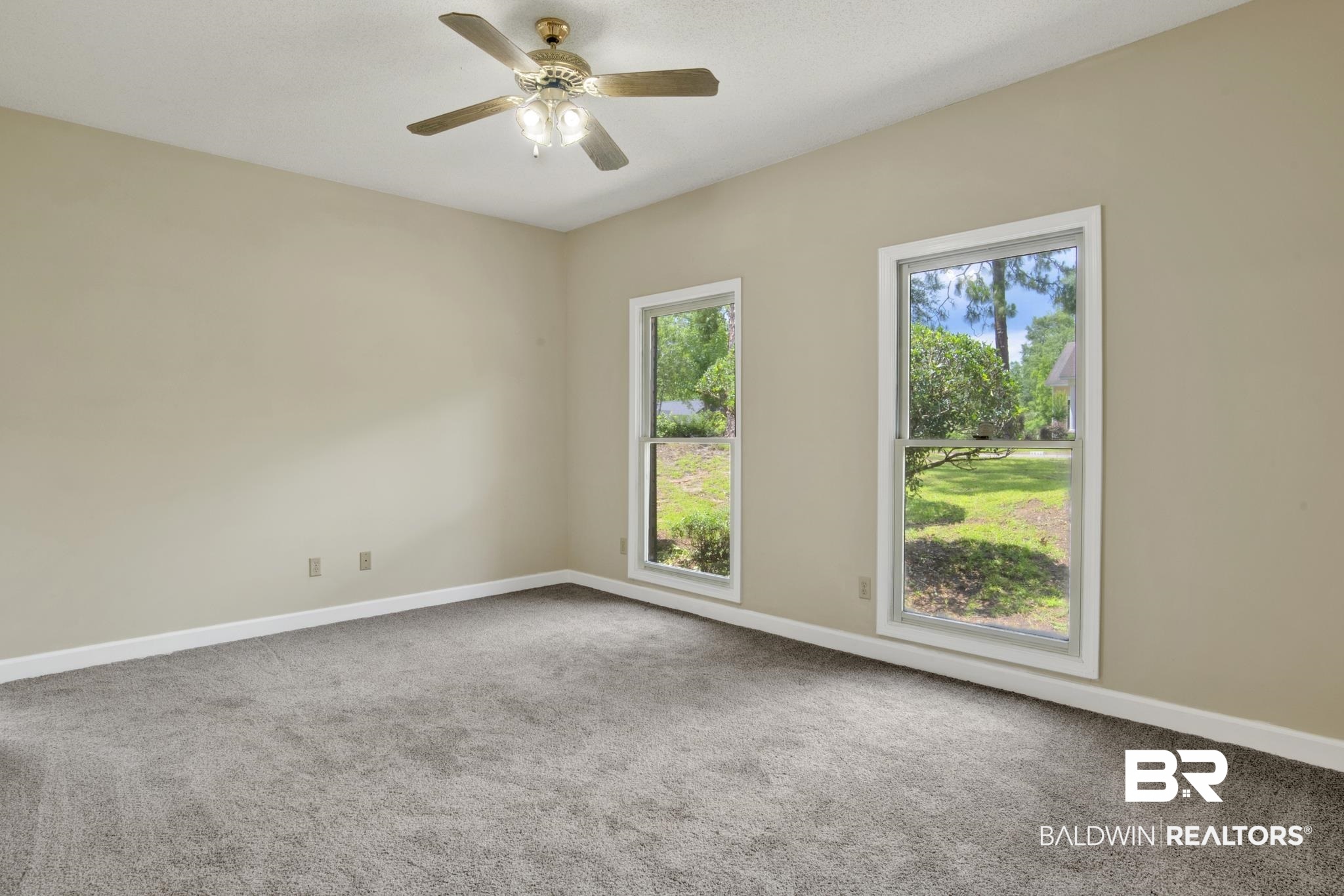 6805 Hunters Court Mobile, AL 36695 - Photo 28 of 37 Carpeted spare room featuring baseboards and ceiling fan