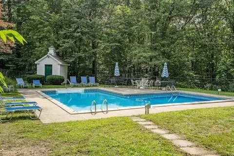 a view of street with wooden fence