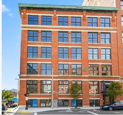 a front view of a building with a street