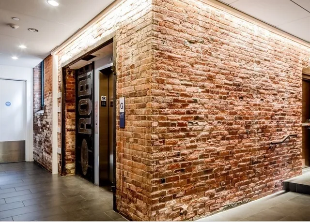 a view of walk in closet with clothes