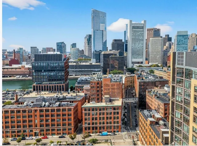 a view of city with tall buildings