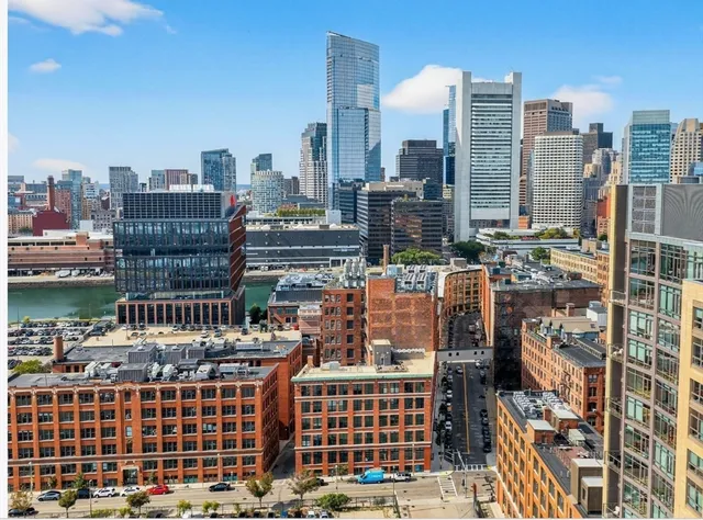 a view of city with tall buildings