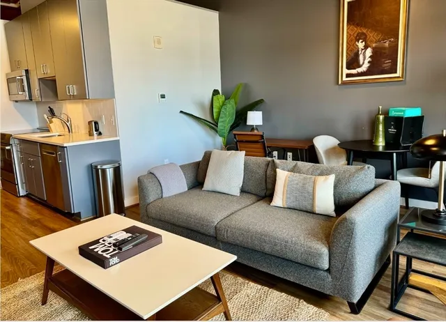 a living room with furniture and a rug
