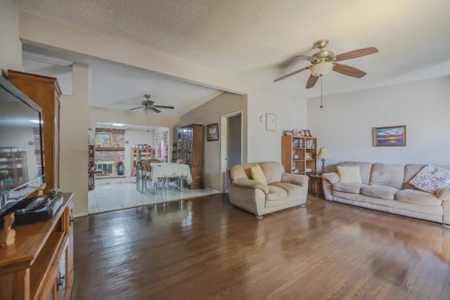 a living room with fireplace furniture and a flat screen tv