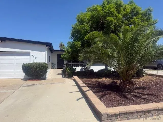 a view of a backyard of the house