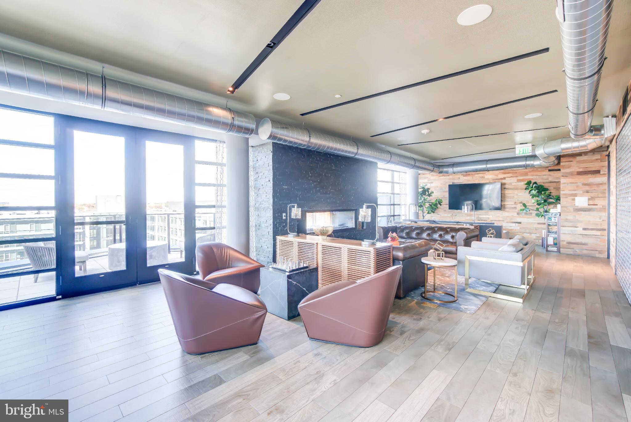1300 4th Street Southeast, Unit 414 Washington, DC 20003 - Photo 19 of 31 a living room with furniture and a large window