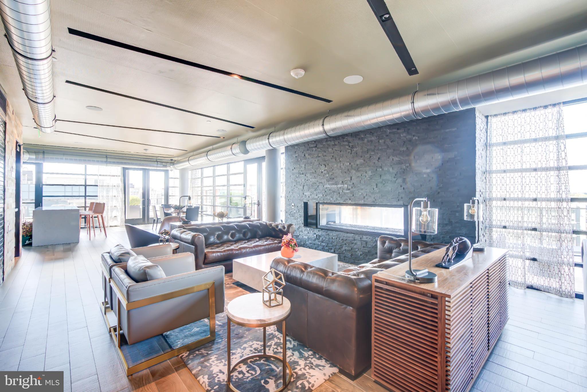 1300 4th Street Southeast, Unit 414 Washington, DC 20003 - Photo 20 of 31 a living room with furniture and a large window
