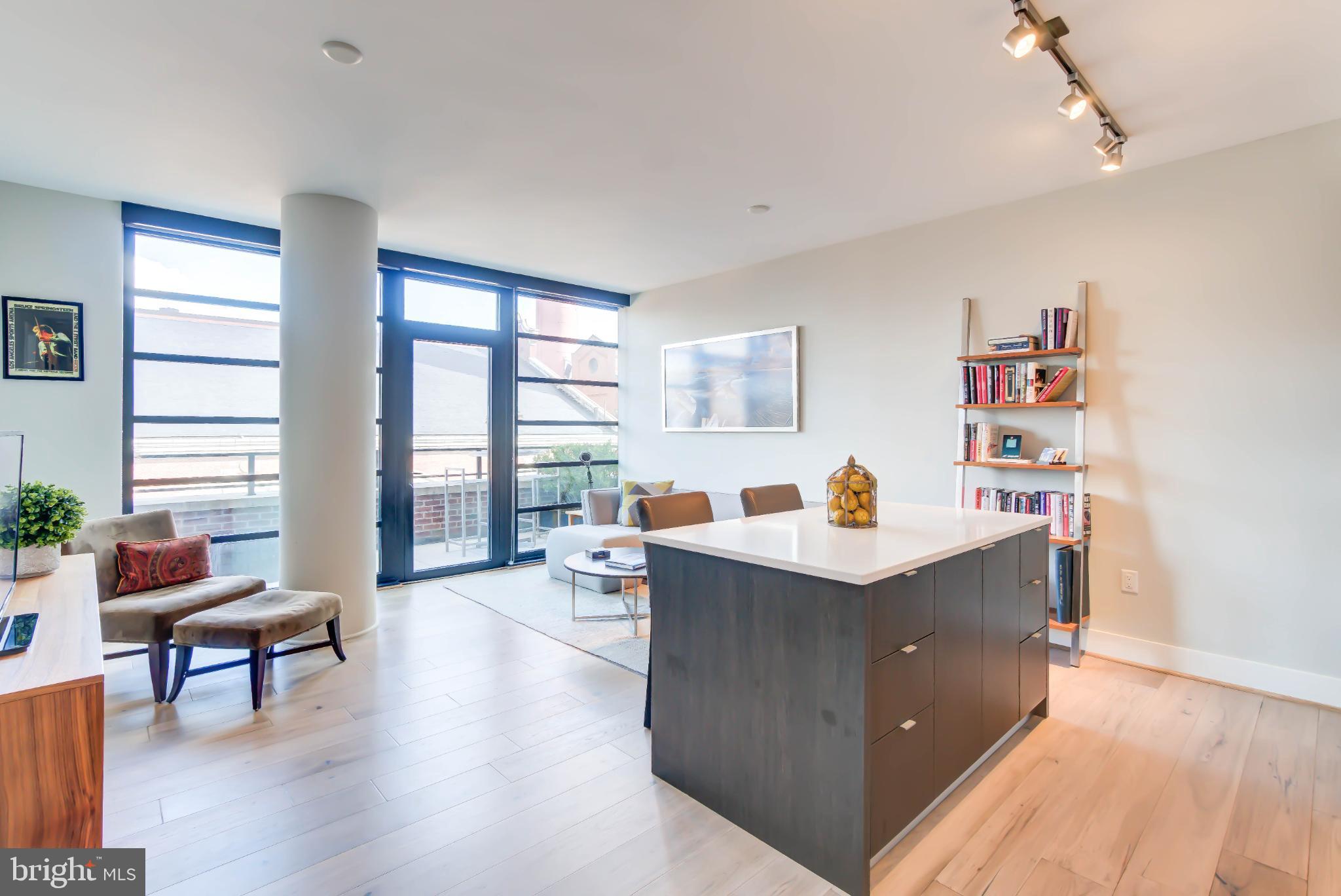 1300 4th Street Southeast, Unit 414 Washington, DC 20003 - Photo 2 of 31 a view of living room with furniture and a large window