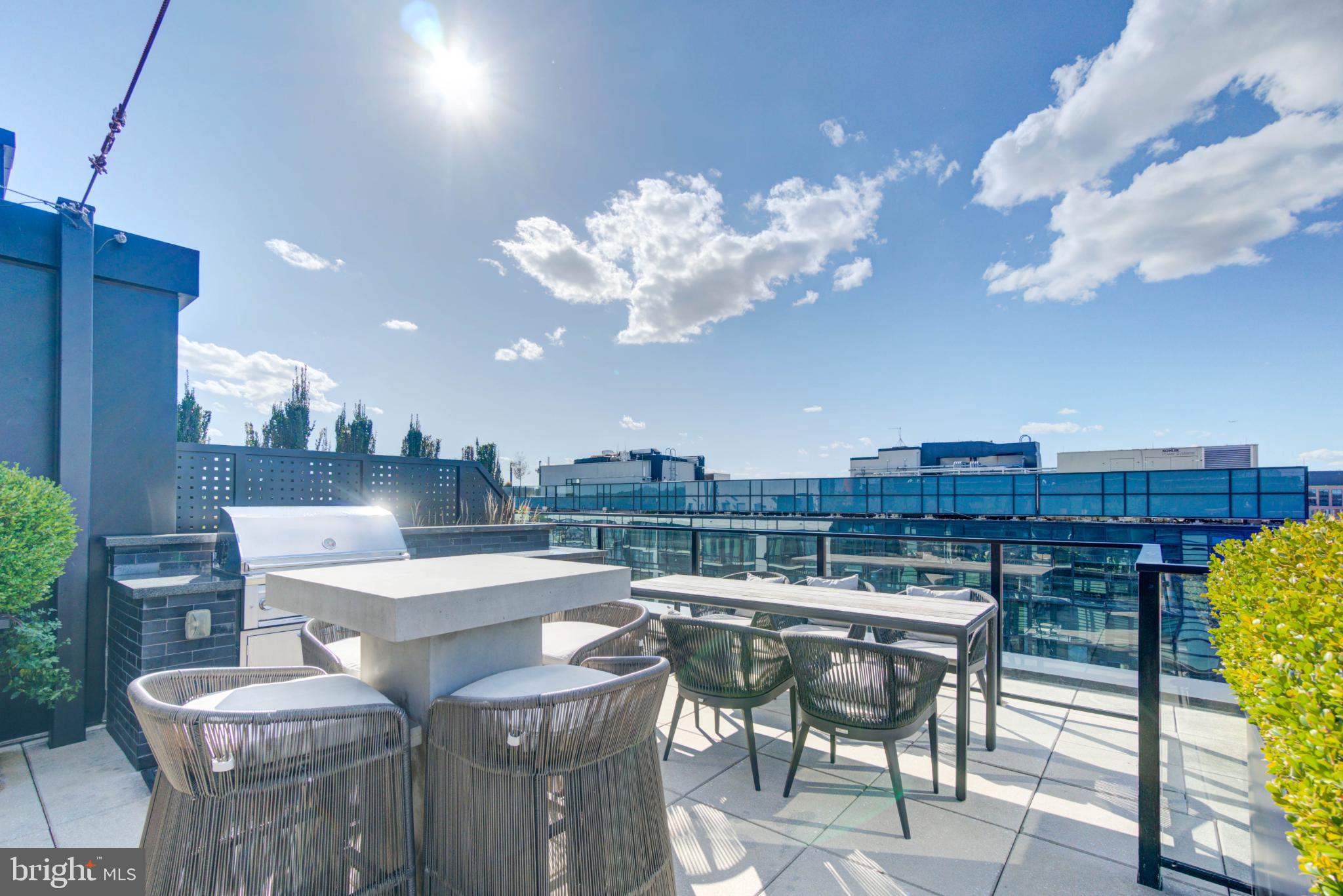 1300 4th Street Southeast, Unit 414 Washington, DC 20003 - Photo 21 of 31 a view of a patio with couches table and chairs