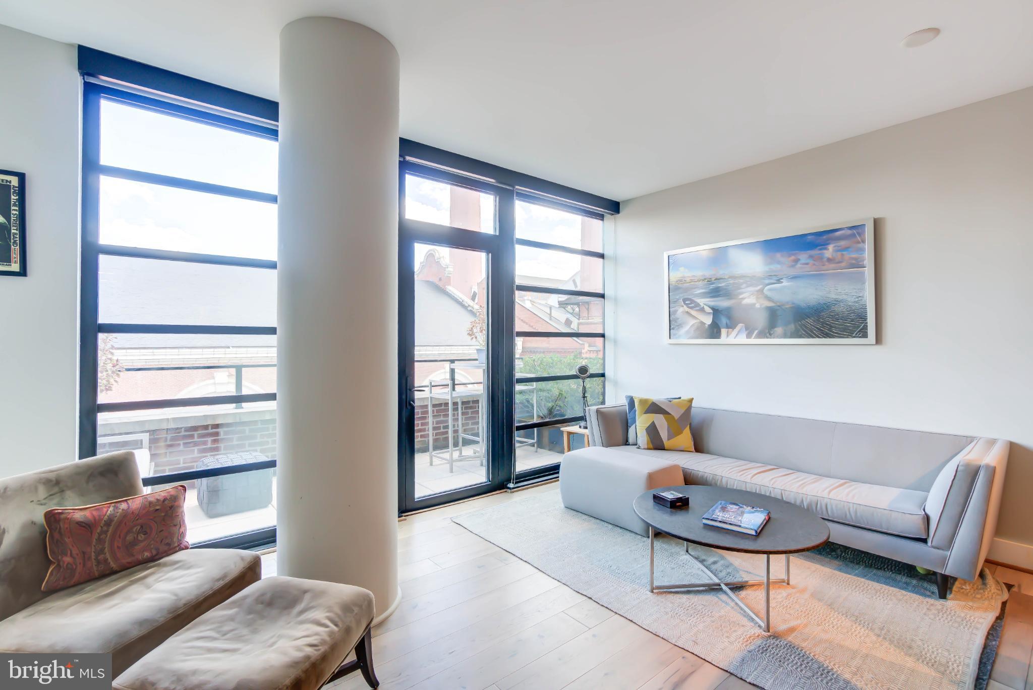 1300 4th Street Southeast, Unit 414 Washington, DC 20003 - Photo 5 of 31 a living room with furniture and a window