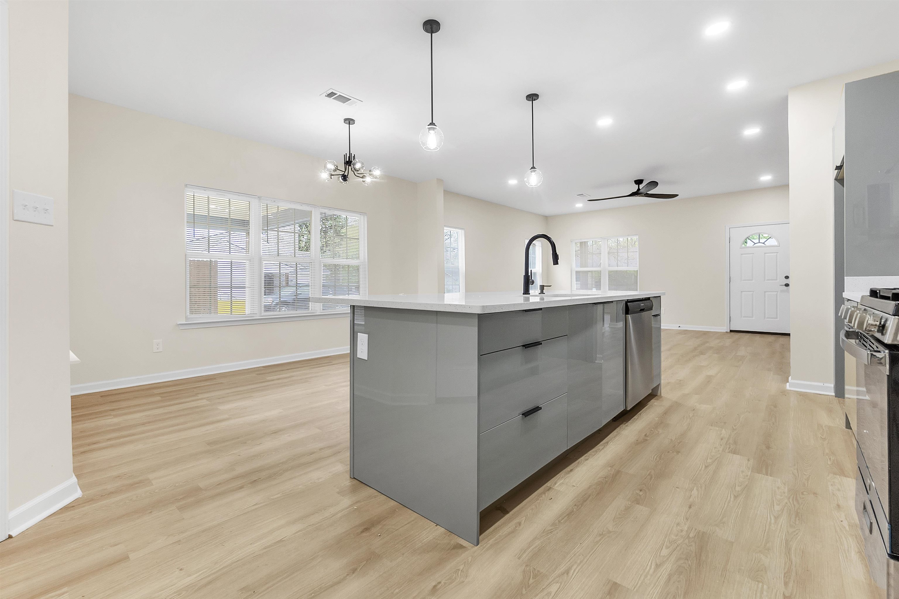 4397 Crescent Park Drive Memphis, TN 38141 - Photo 11 of 40 Kitchen featuring a healthy amount of sunlight, a sink, visible vents, modern cabinets, and appliances with stainless steel finishes