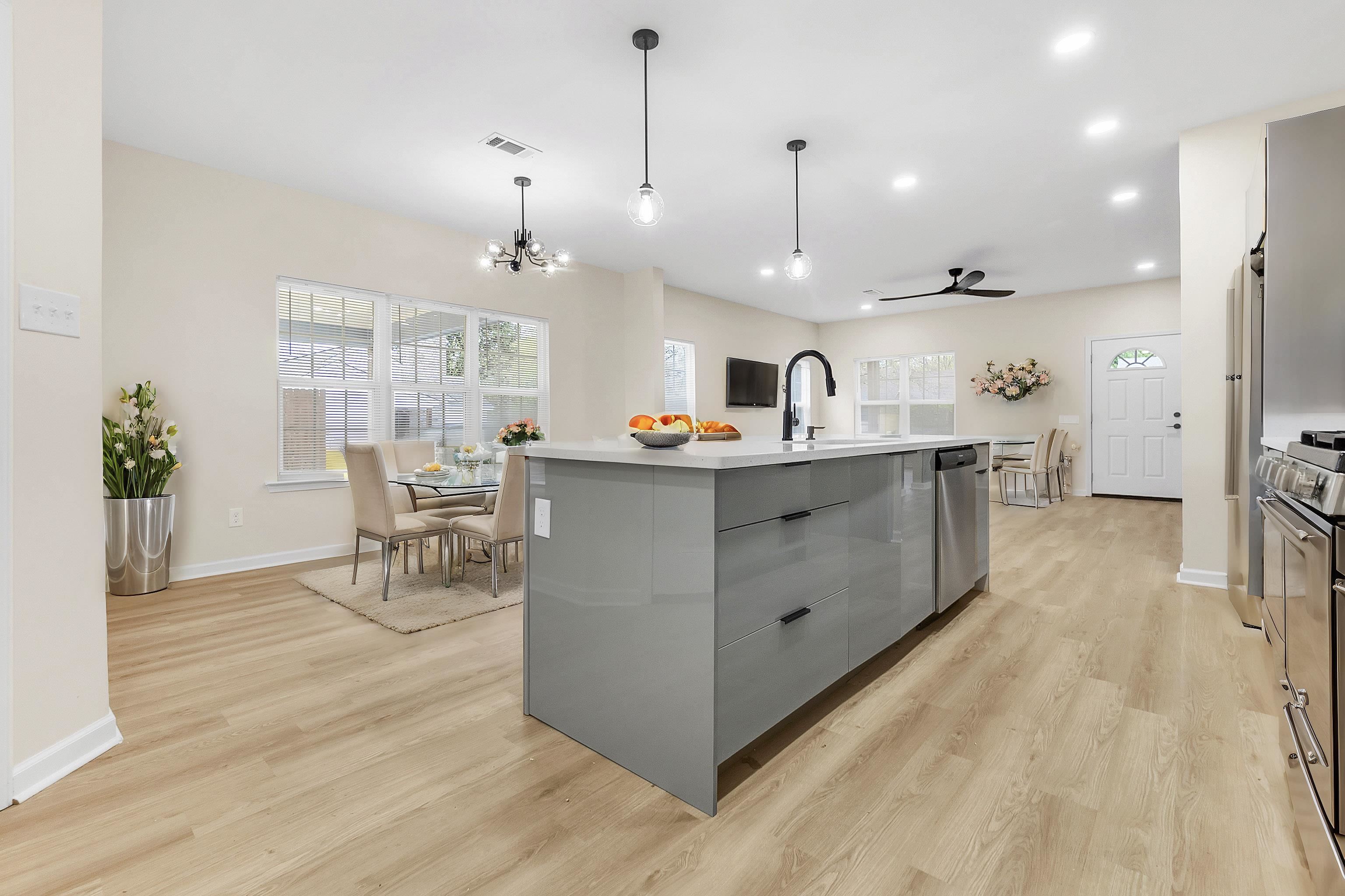 4397 Crescent Park Drive Memphis, TN 38141 - Photo 12 of 40 Kitchen with gray cabinets, a sink, appliances with stainless steel finishes, light wood-type flooring, and visible vents