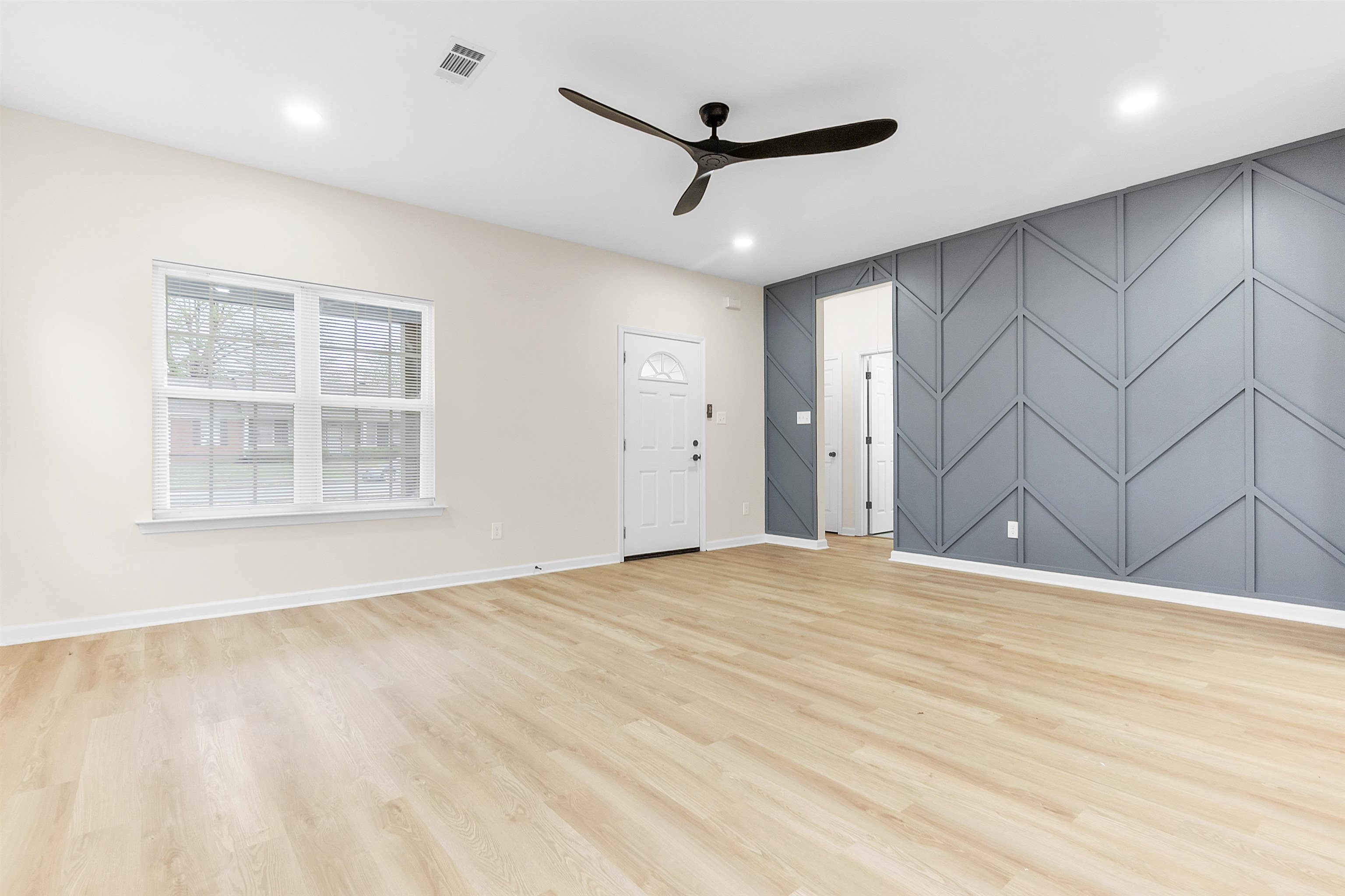 4397 Crescent Park Drive Memphis, TN 38141 - Photo 18 of 40 Unfurnished living room featuring light wood finished floors, baseboards, visible vents, ceiling fan, and recessed lighting