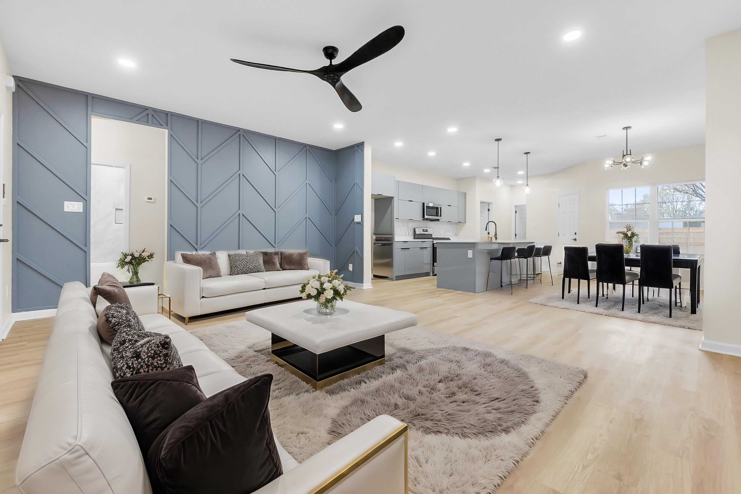 4397 Crescent Park Drive Memphis, TN 38141 - Photo 21 of 40 Living room featuring recessed lighting, an accent wall, light wood-style floors, and ceiling fan with notable chandelier