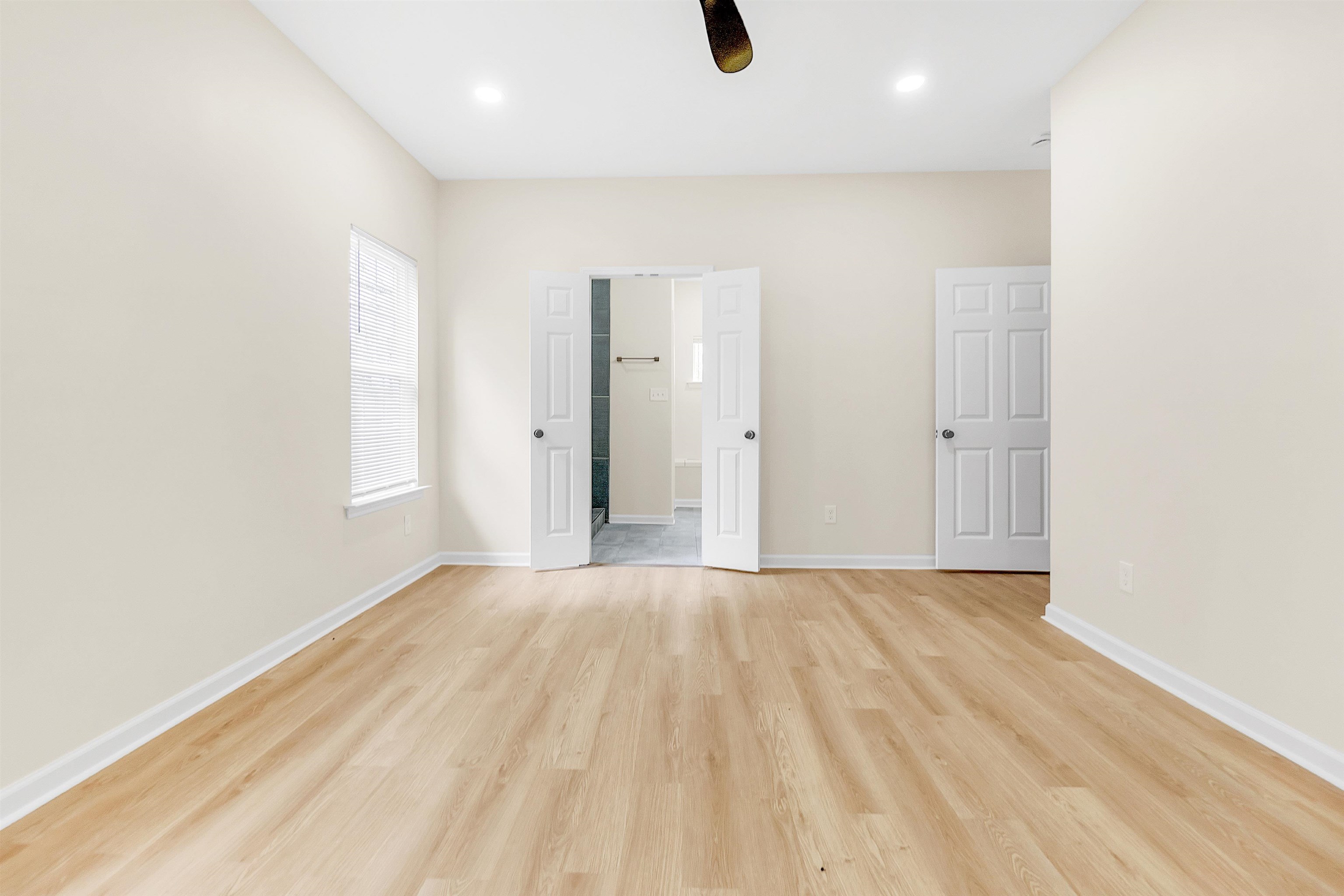 4397 Crescent Park Drive Memphis, TN 38141 - Photo 28 of 40 Unfurnished bedroom with baseboards, light wood finished floors, and recessed lighting