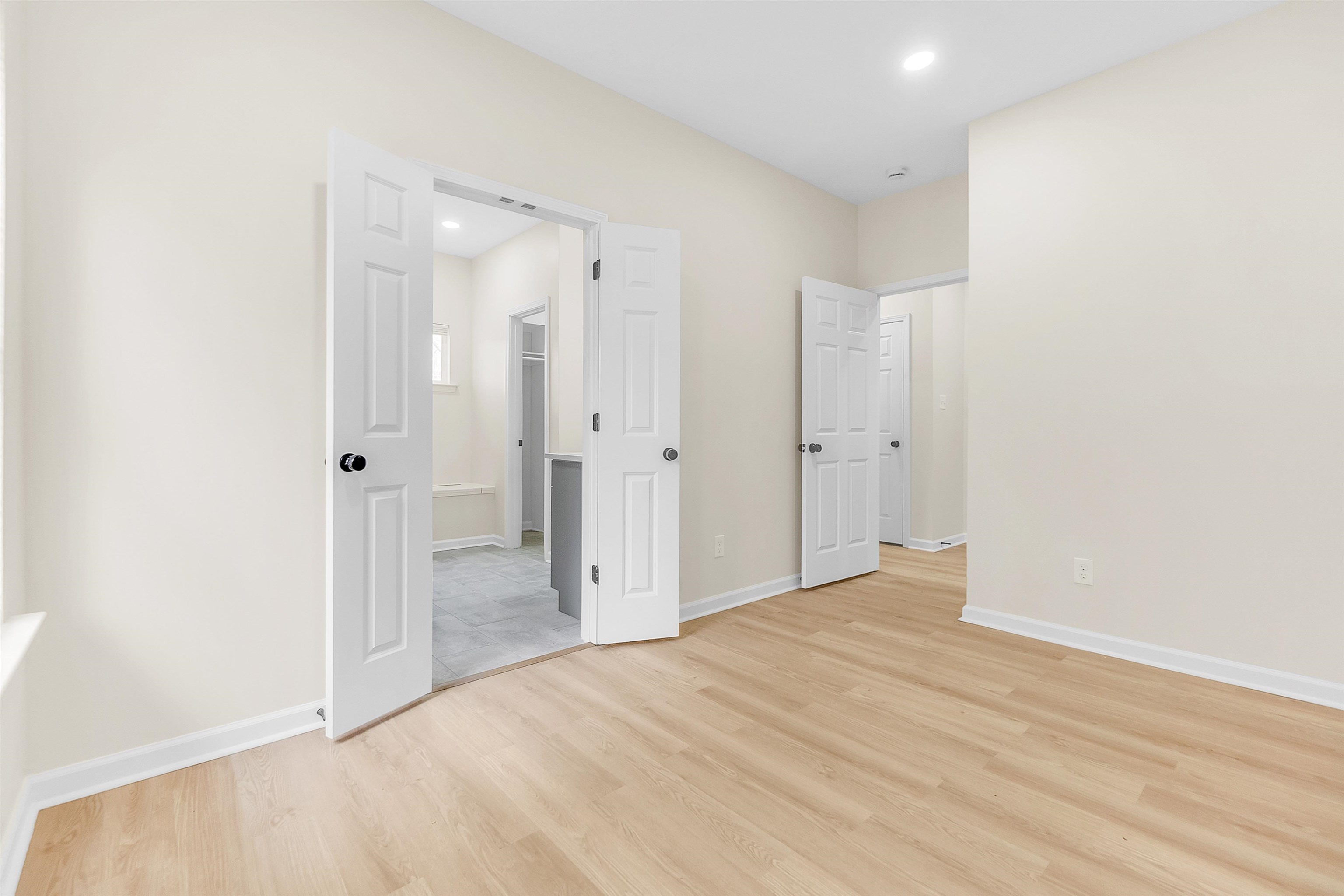 4397 Crescent Park Drive Memphis, TN 38141 - Photo 29 of 40 Unfurnished bedroom featuring recessed lighting, a walk in closet, baseboards, and light wood-type flooring