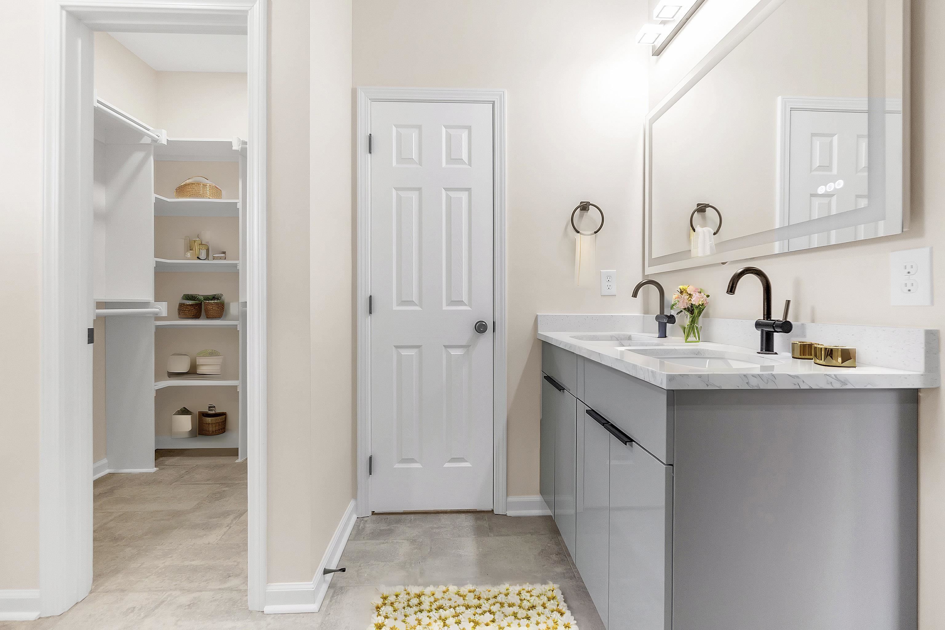 4397 Crescent Park Drive Memphis, TN 38141 - Photo 35 of 40 Bathroom with double vanity, a sink, and baseboards