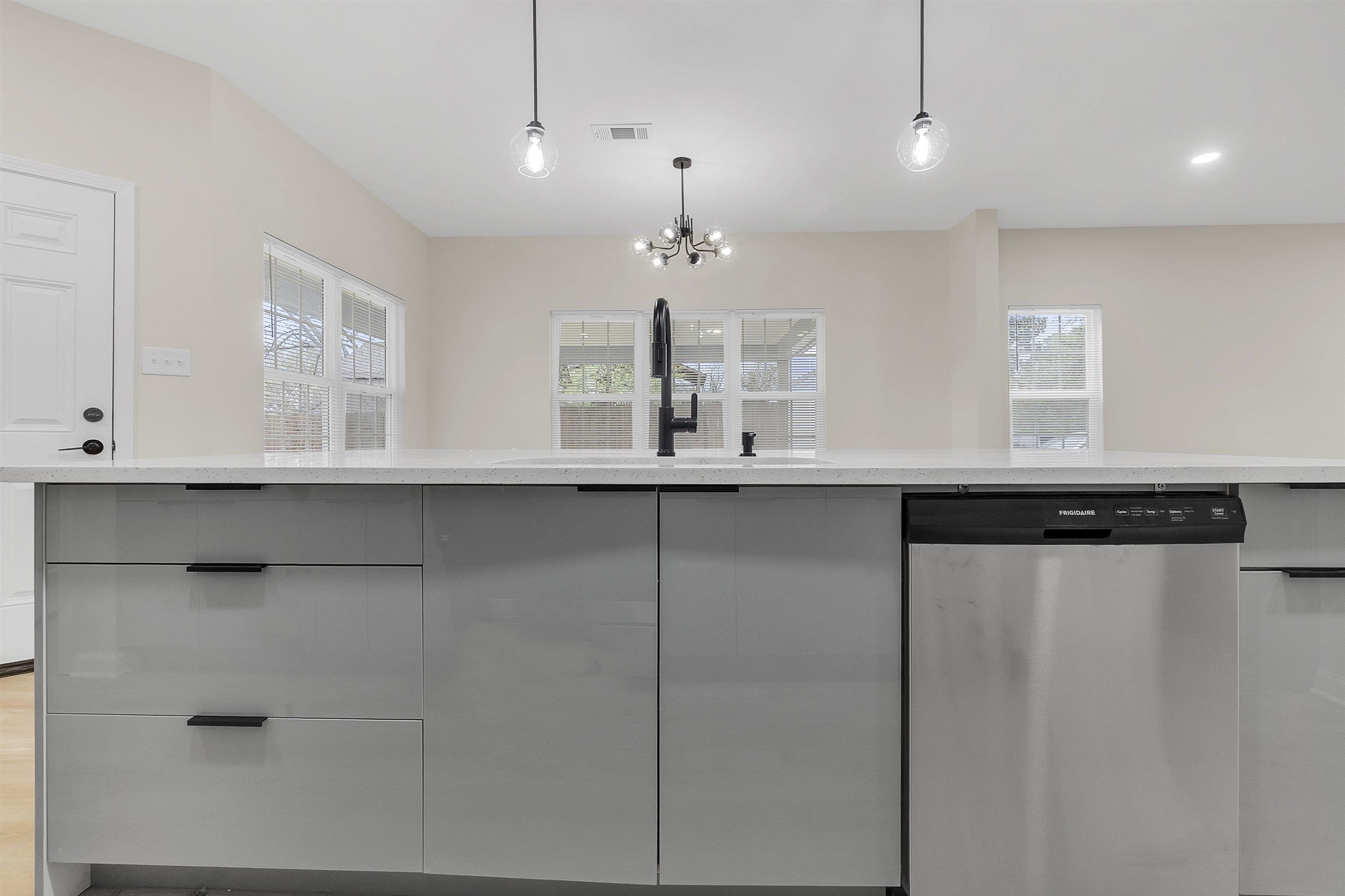 4397 Crescent Park Drive Memphis, TN 38141 - Photo 9 of 40 Kitchen featuring a notable chandelier, a sink, dishwasher, gray cabinetry, and visible vents