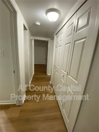 a view of a entryway door with wooden floor