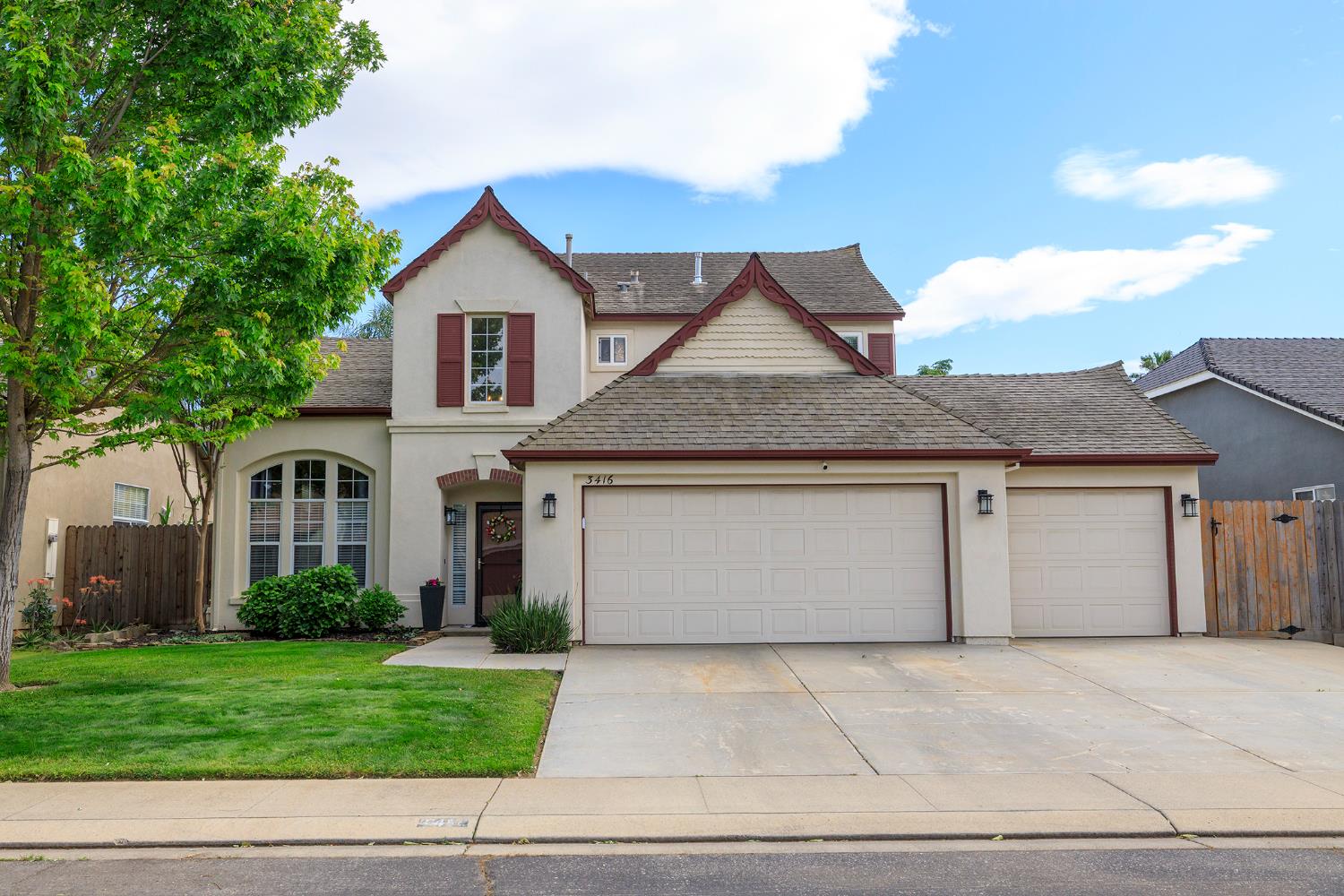 3416 Will Scarlet Way Modesto, CA 95355 - Photo 1 of 56 a front view of a house with a yard