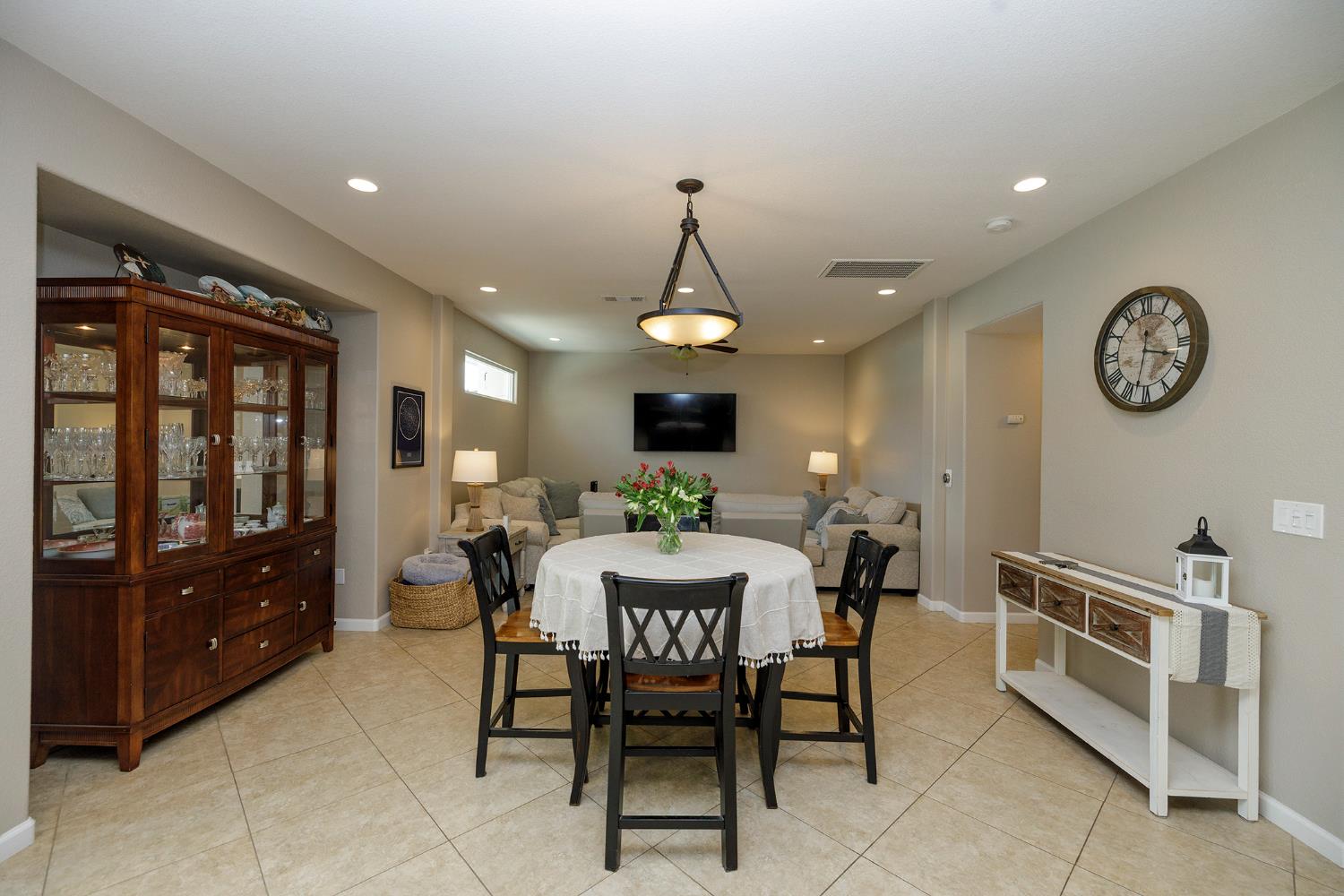 3416 Will Scarlet Way Modesto, CA 95355 - Photo 11 of 56 a dining room with a wooden table and chairs