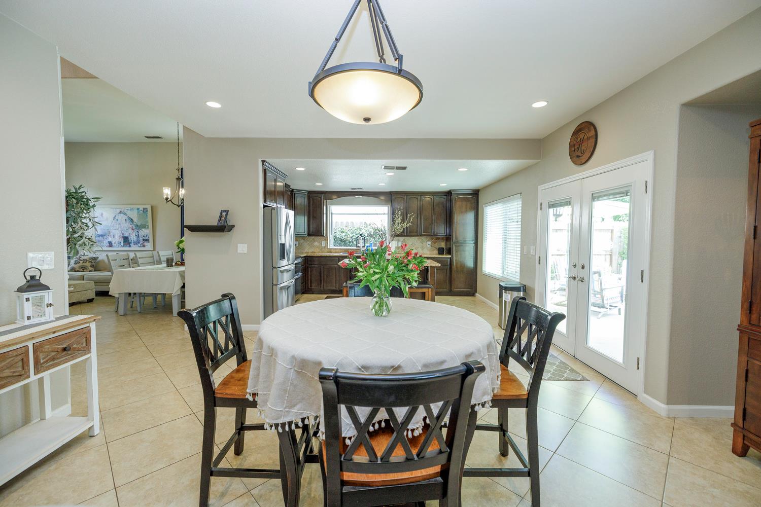 3416 Will Scarlet Way Modesto, CA 95355 - Photo 13 of 56 a view of a dining room with furniture and window