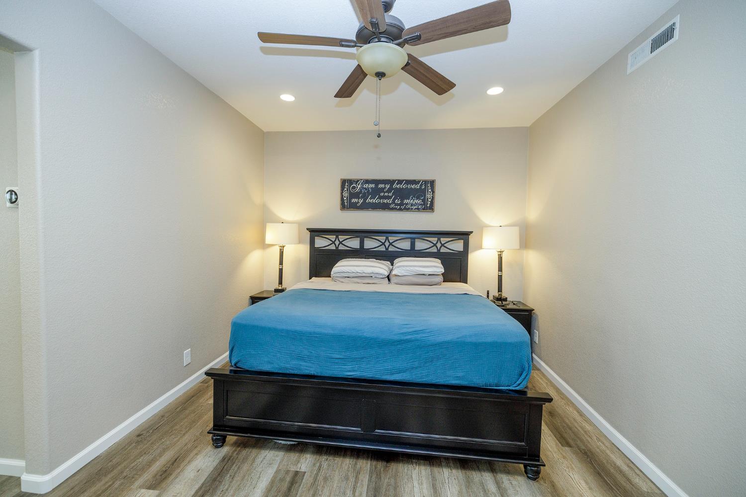 3416 Will Scarlet Way Modesto, CA 95355 - Photo 26 of 56 a bedroom with a bed and a ceiling fan