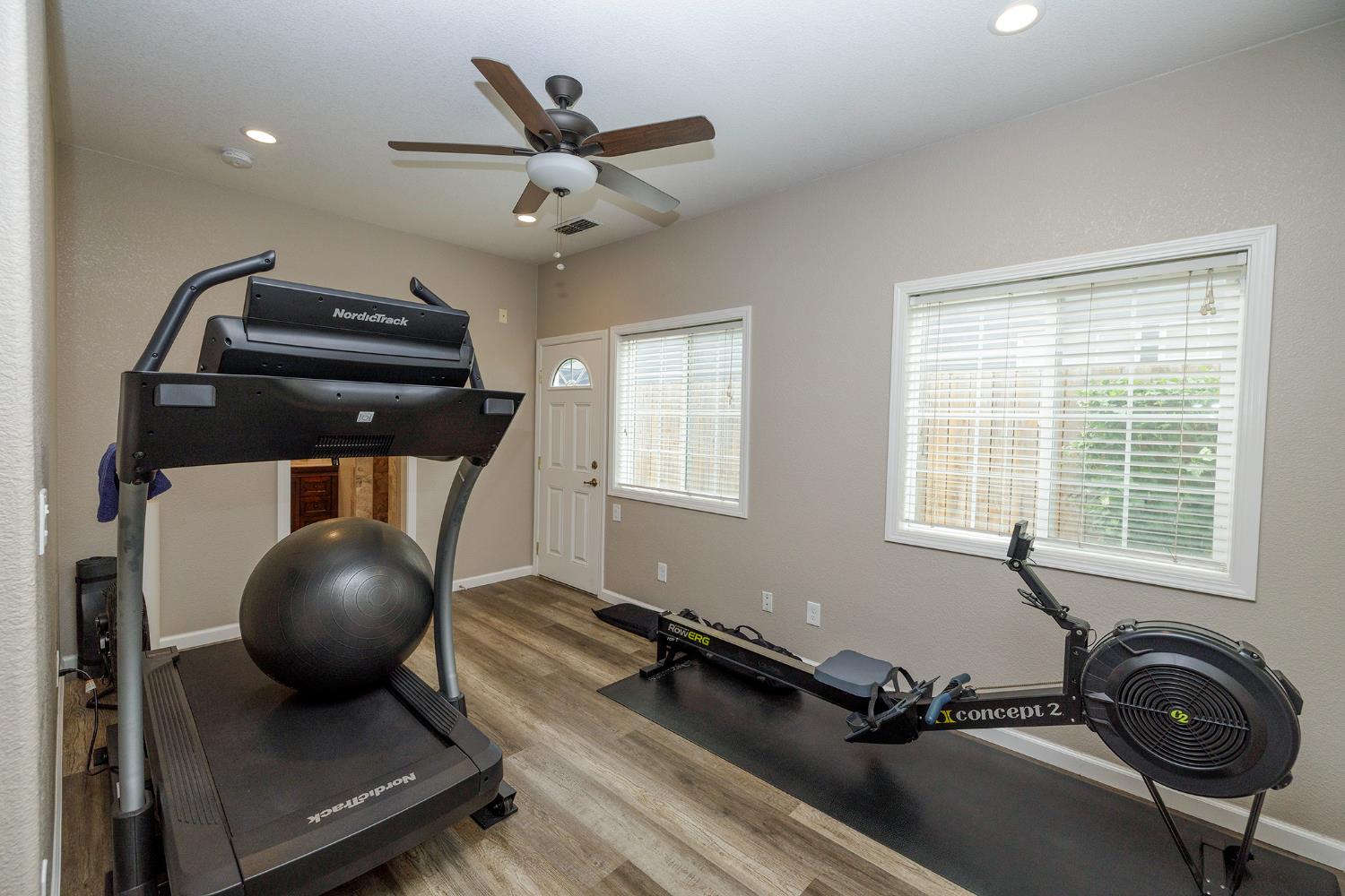 3416 Will Scarlet Way Modesto, CA 95355 - Photo 27 of 56 a room with gym equipment and windows