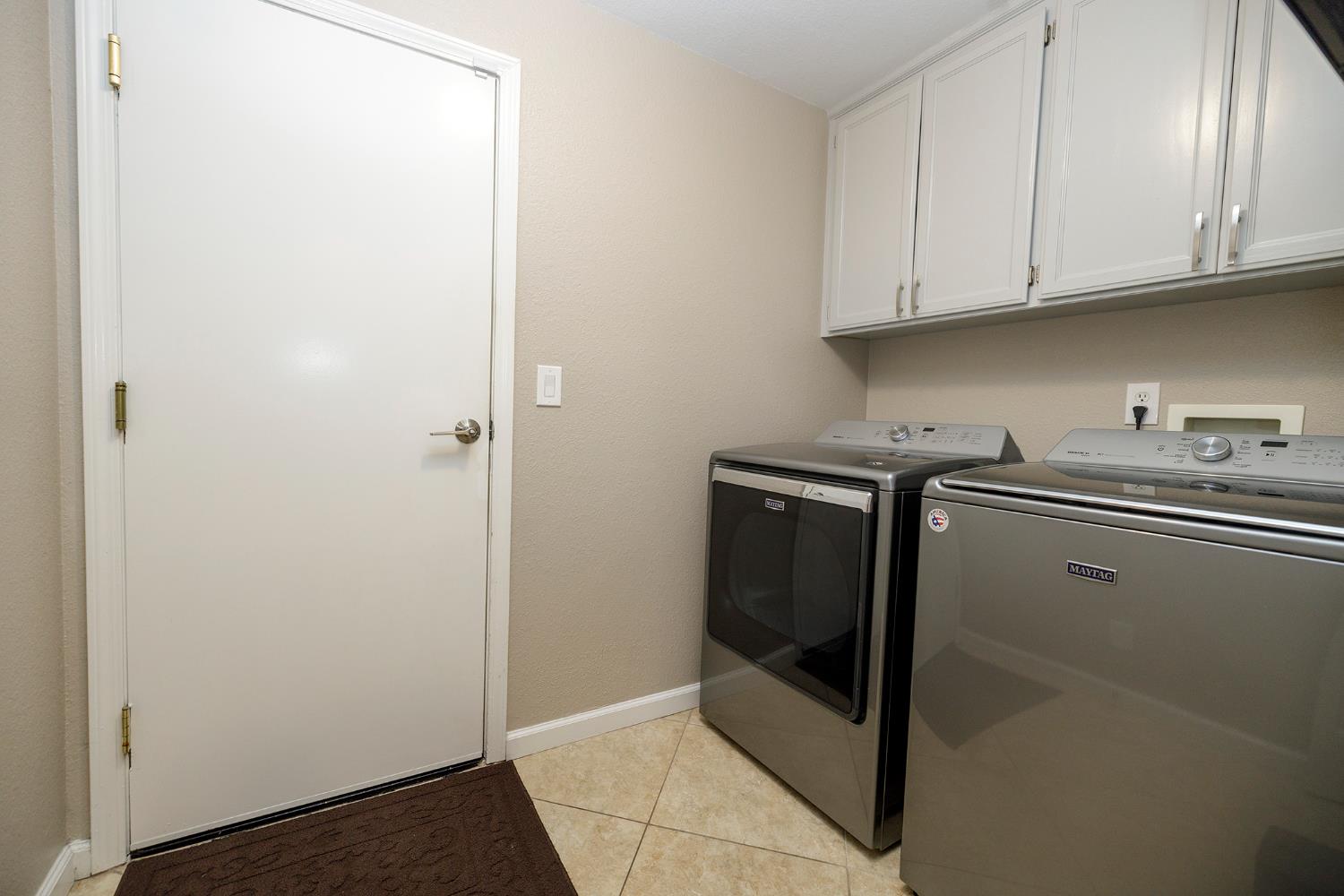 3416 Will Scarlet Way Modesto, CA 95355 - Photo 35 of 56 a kitchen with stainless steel appliances granite countertop a refrigerator and a sink